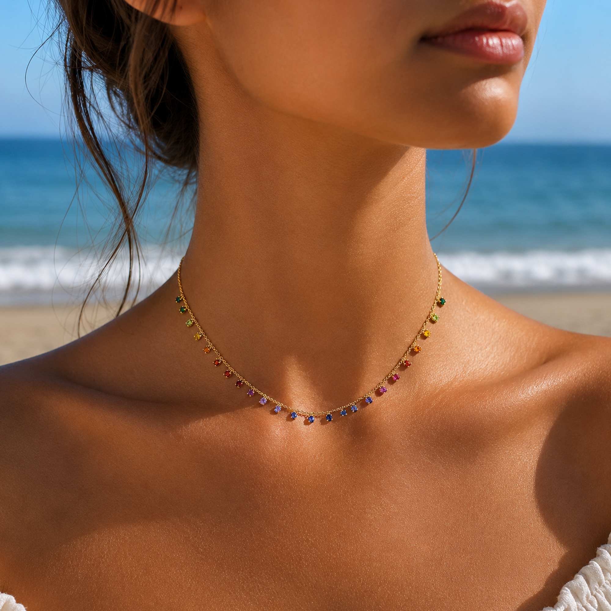 Close-up of a woman's neck with a colorful beaded necklace against a beach background in india