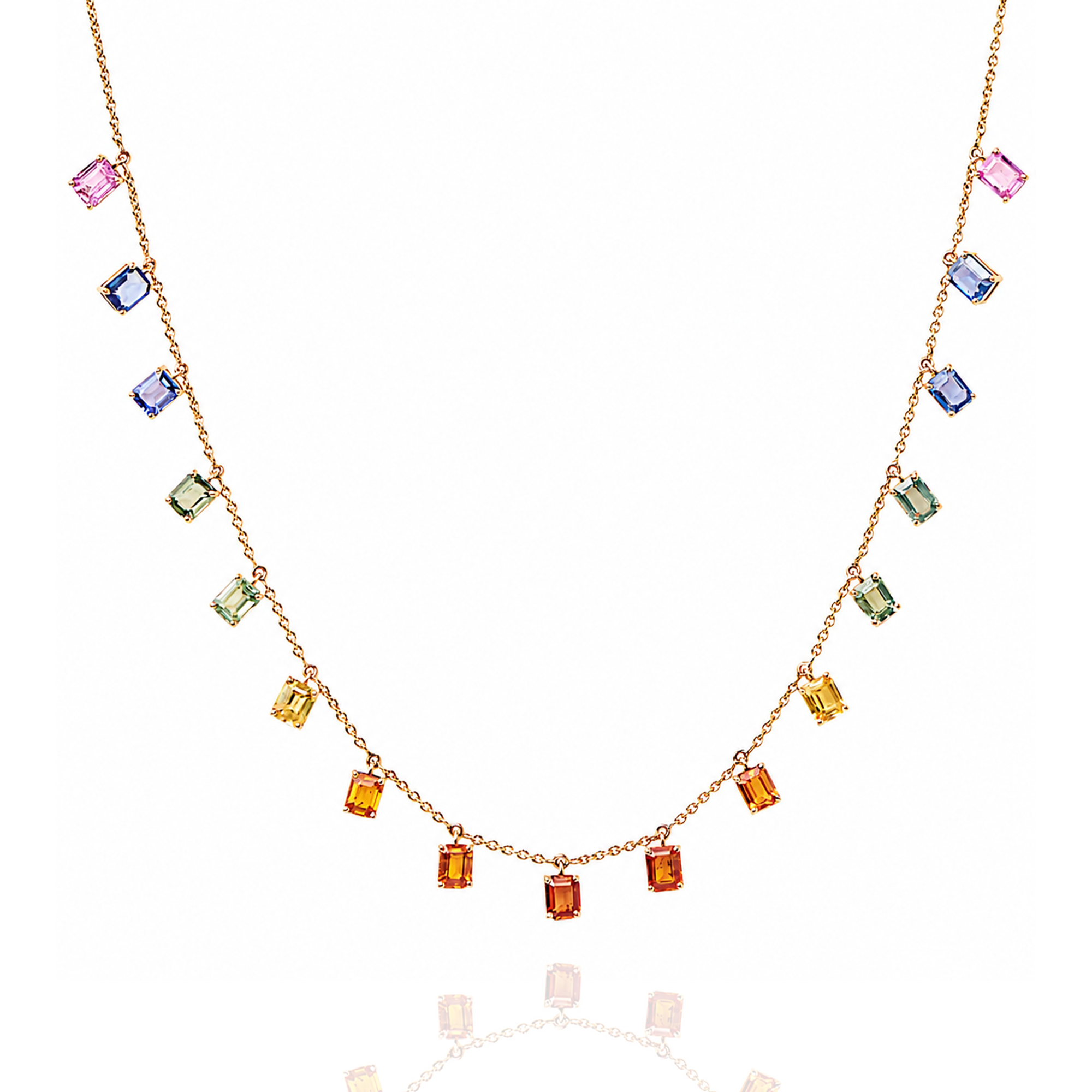 Necklace with multicolored gemstones on a white background in india