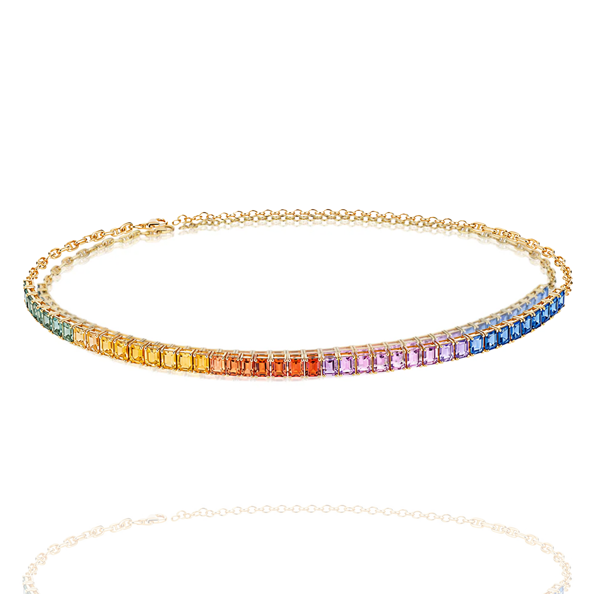 Gold necklace with rainbow-colored gemstones on a white background in india