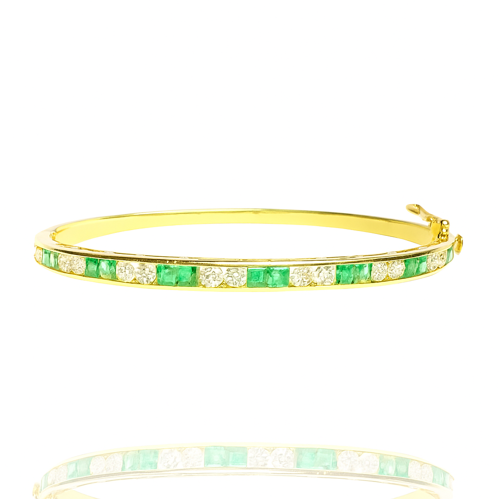 Emerald and diamond gold half bangle, handcrafted fine jewellery, luxury elegant bracelet for women