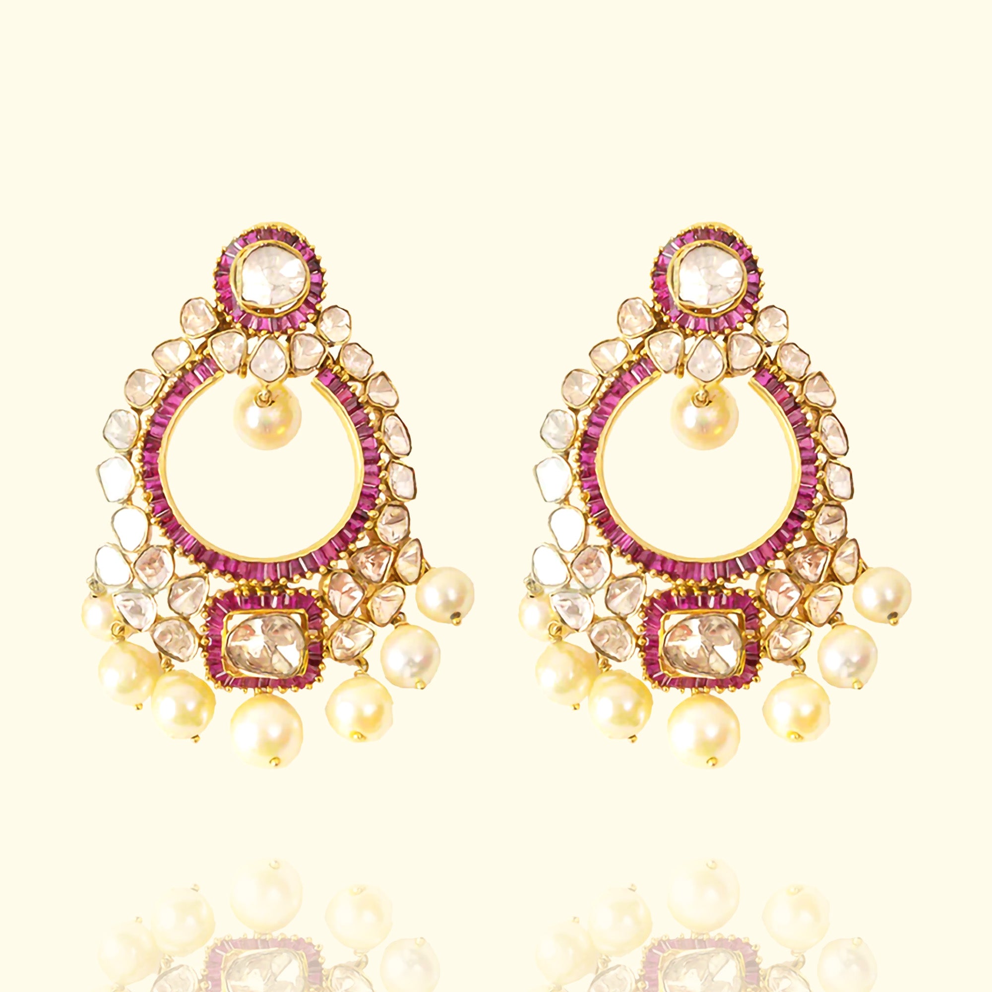Gold chandelier earrings with ruby stones and Polki diamonds, handcrafted ethnic design