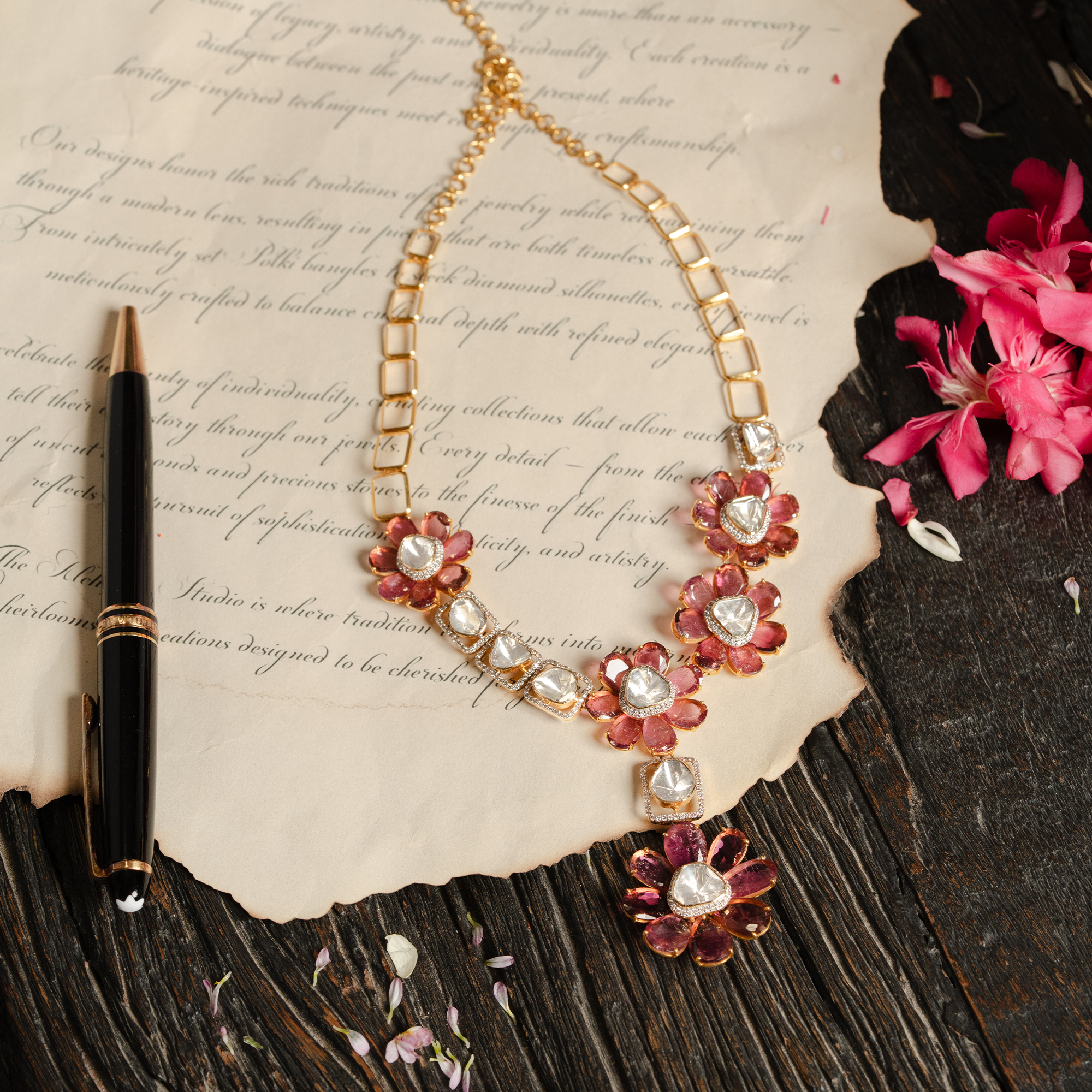 A contemporary gold polki necklace featuring an asymmetrical arrangement of floral motifs with vibrant tourmaline petal and central polki diamonds, interspersed with geometric rectangular links encrusted with pavé diamonds and additional uncut diamonds.