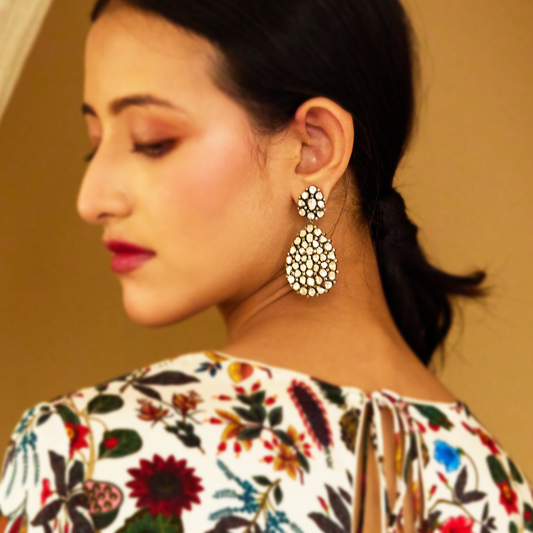 Gold earrings with Polki diamond detailing, handcrafted ethnic chandelier style