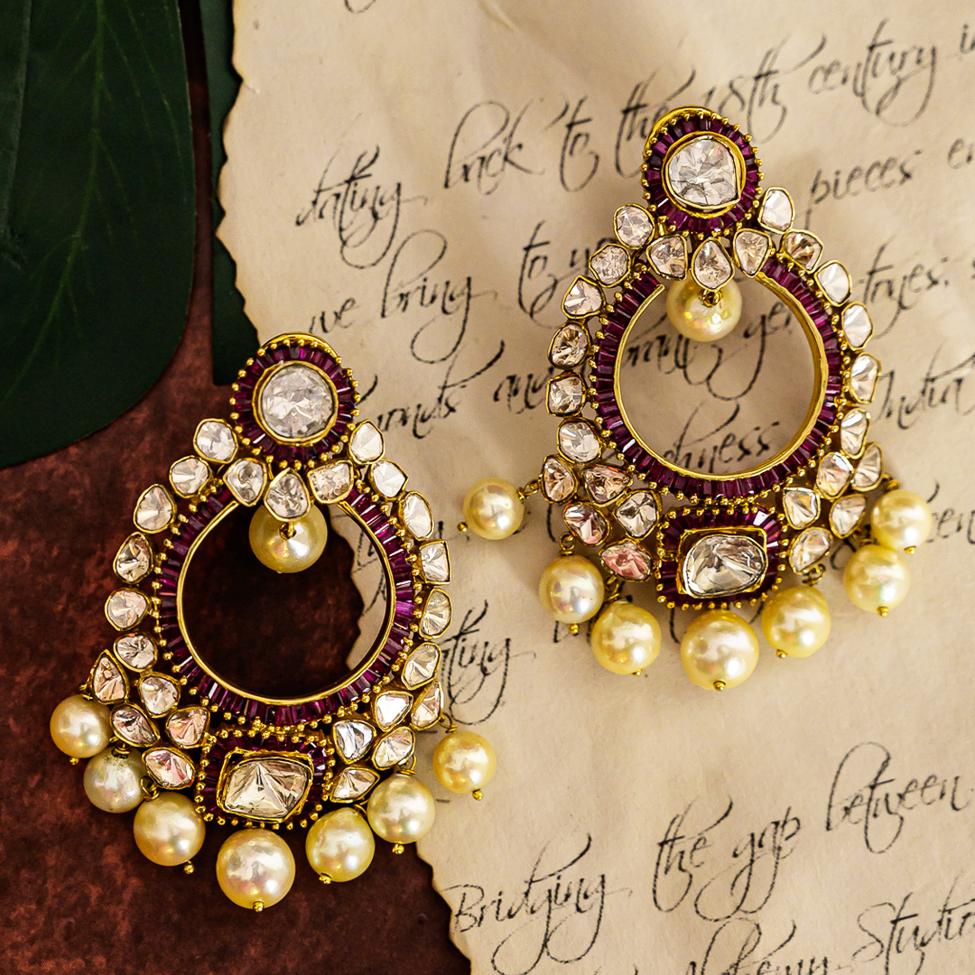 Gold chandelier earrings with ruby stones and Polki diamonds, handcrafted ethnic design
