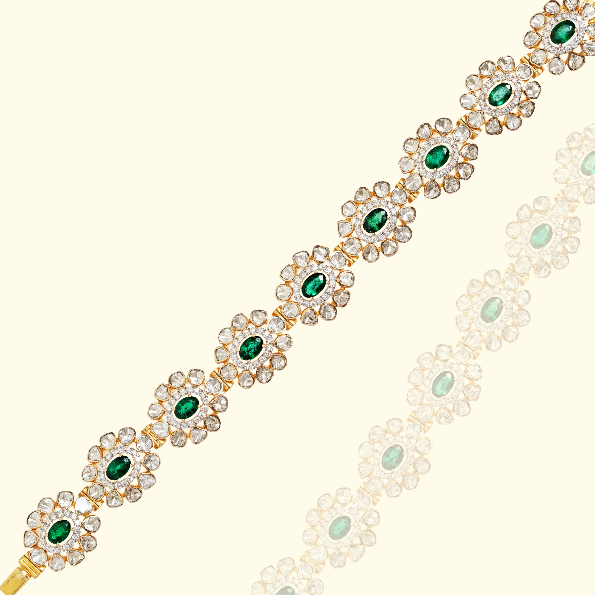 A delicate gold tennis-style bracelet featuring oval-cut emerald centers surrounded by sparkling diamond petals in a continuous floral link design in india