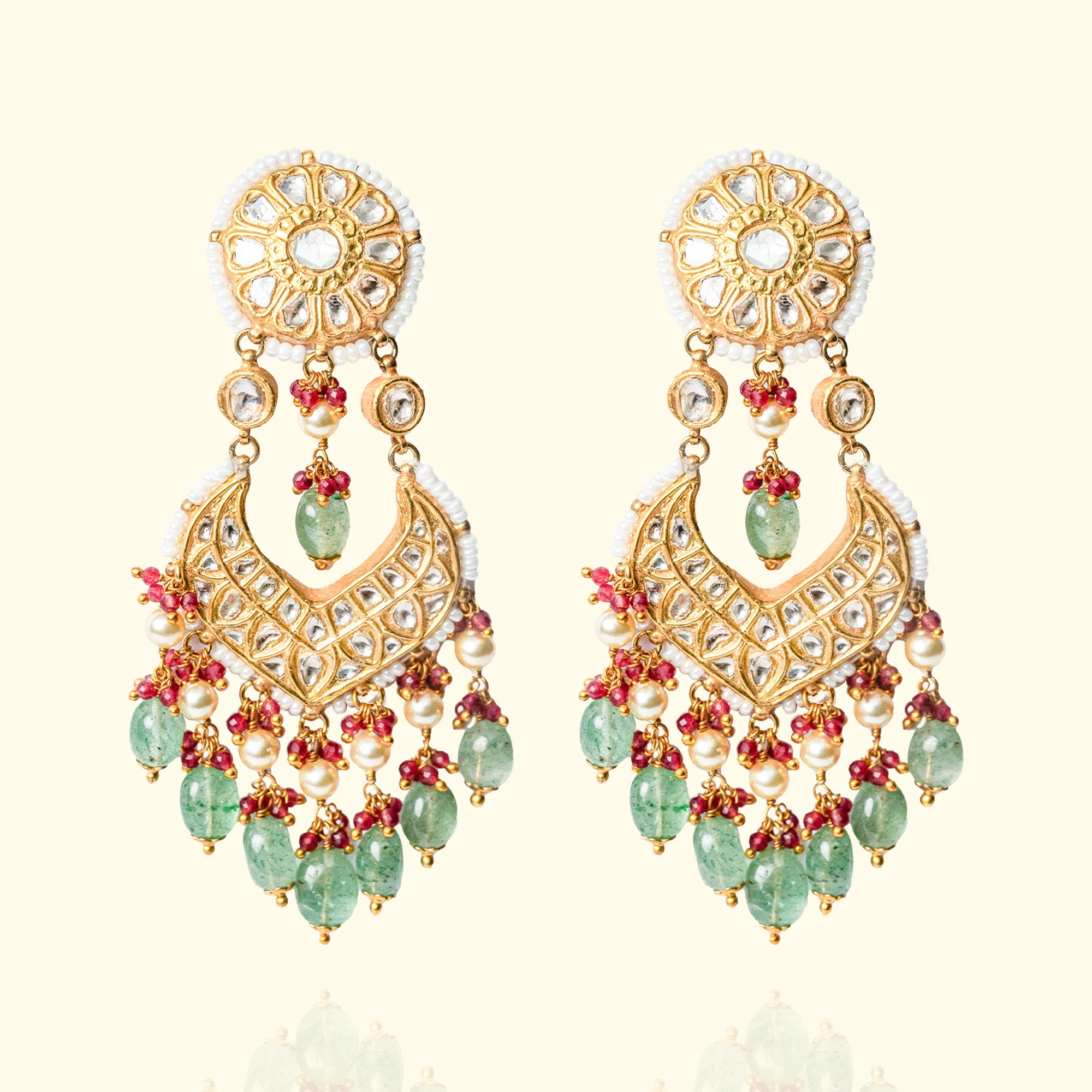 Traditional gold chandelier earrings with emerald and Polki diamond detailing