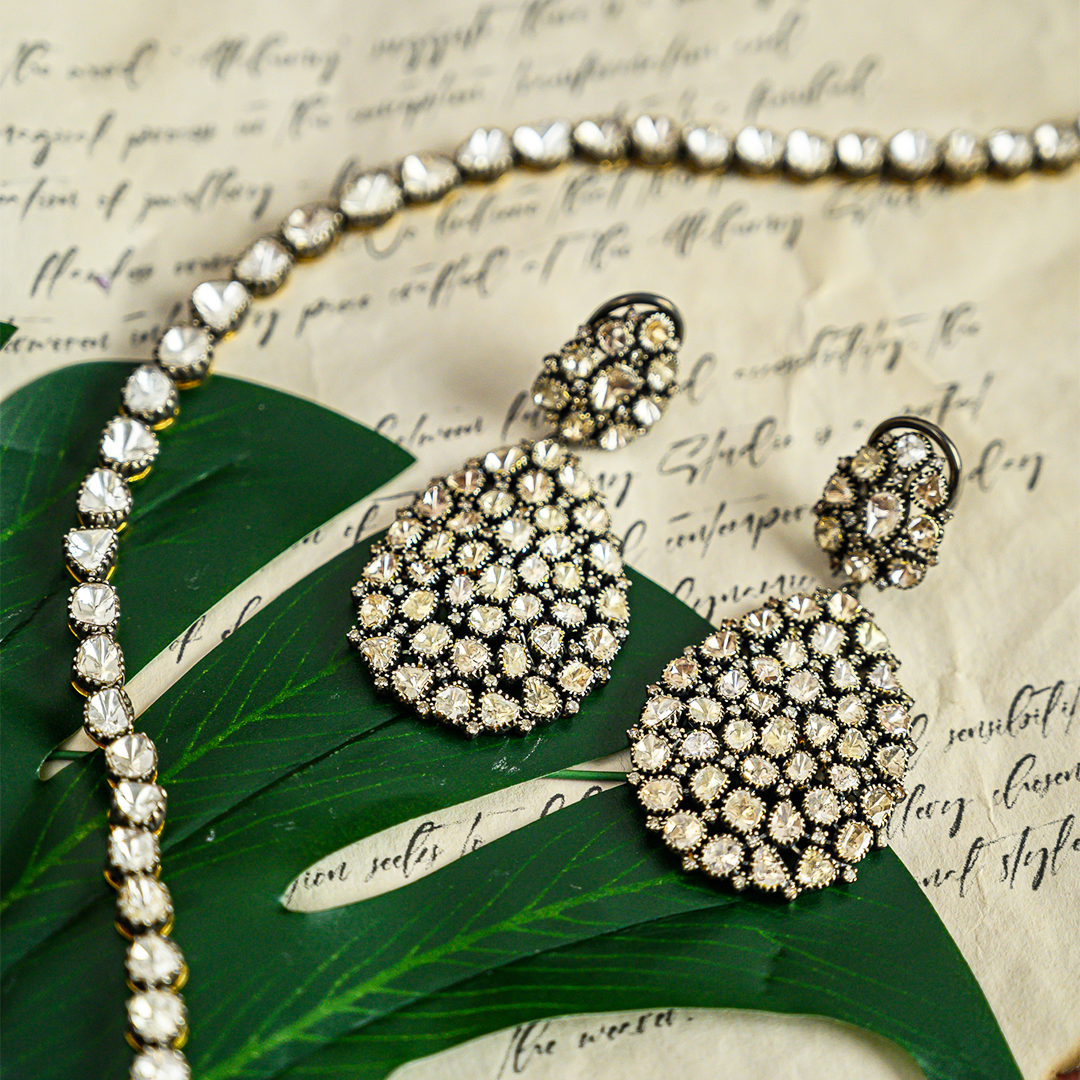 Gold earrings with Polki diamond detailing, handcrafted ethnic chandelier style