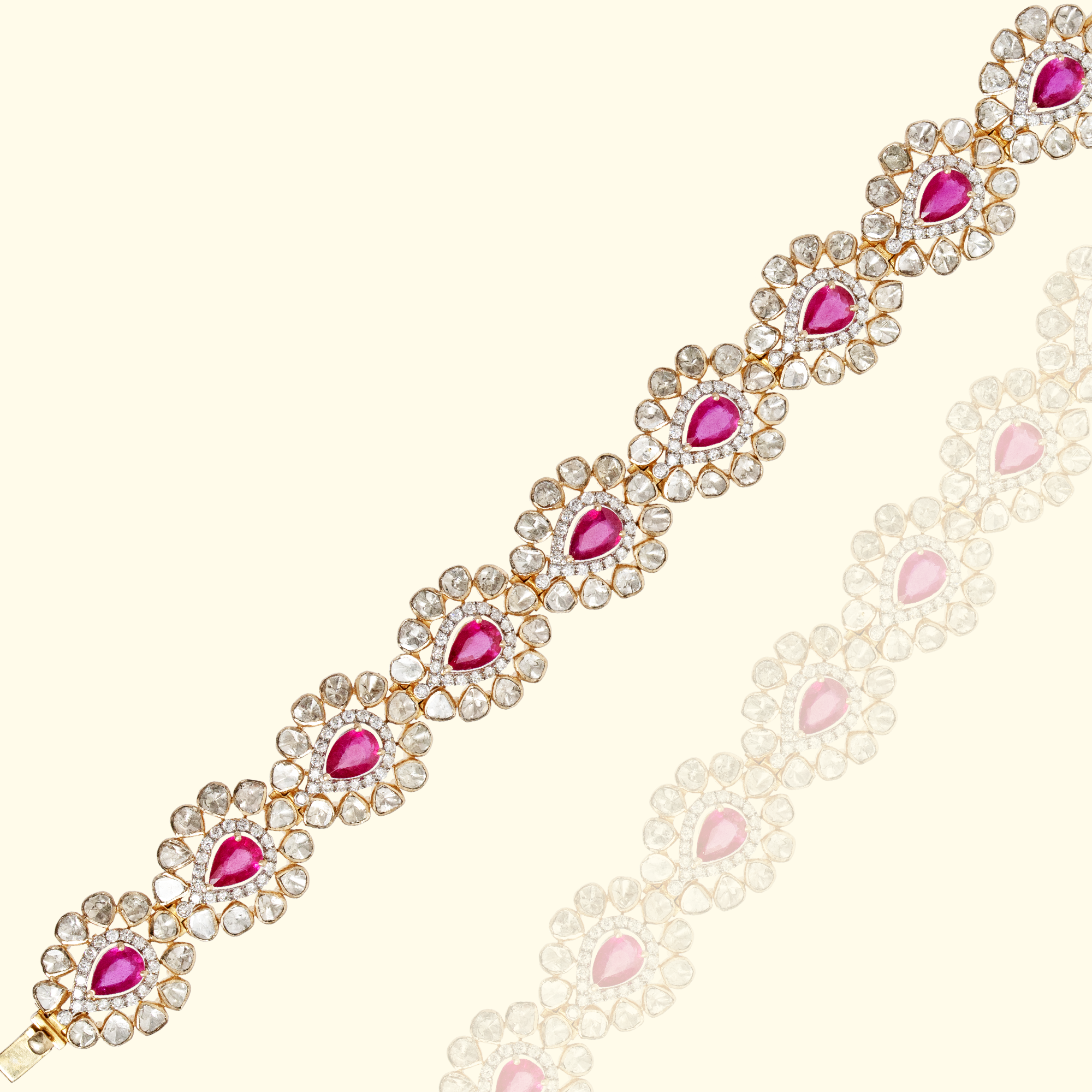 High-resolution studio shot of a gold ruby and Polki diamond link bracelet with teardrop gemstone centers and white diamond halos in india