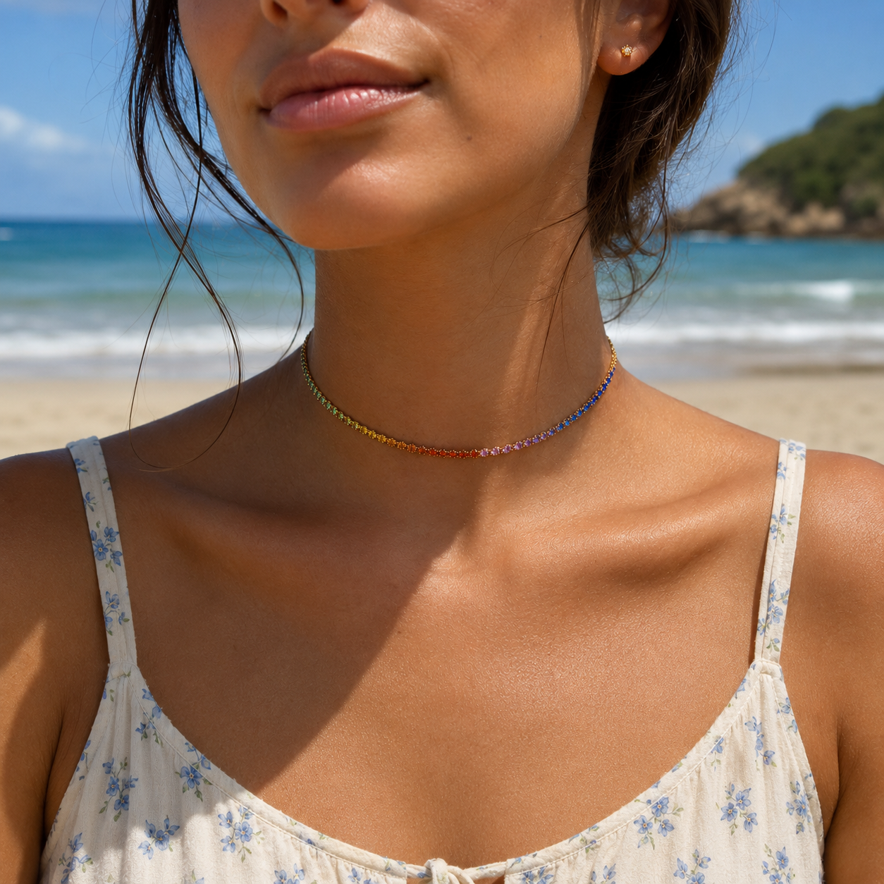 Woman wearing a colorful necklace on a beach in india