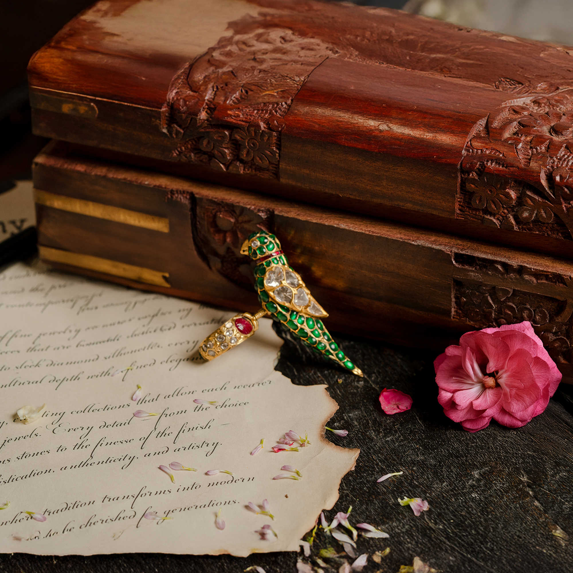 Whimsical gold ring featuring a 3D bird motif encrusted with green emeralds and polki diamonds.
