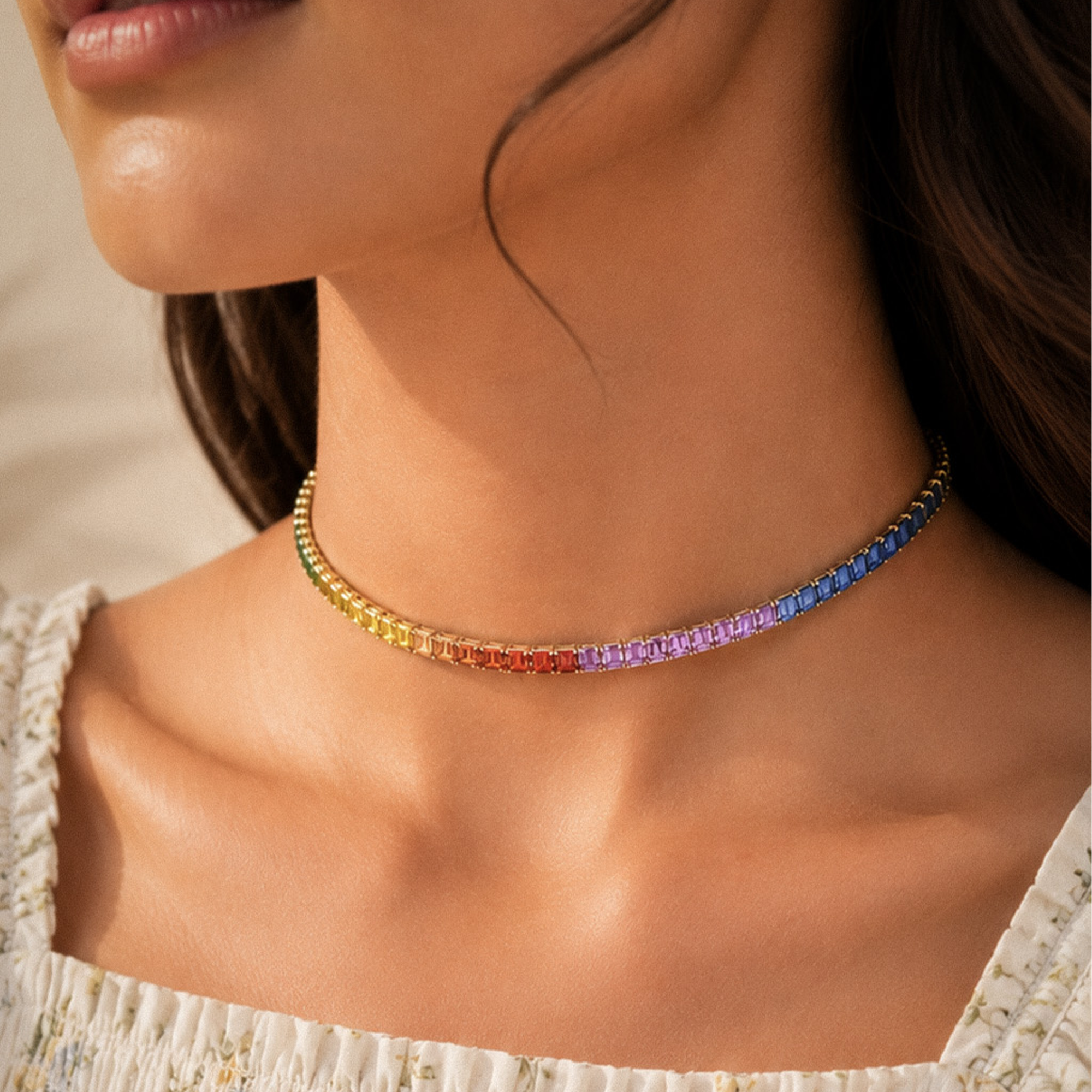 Close-up of a woman wearing a rainbow-colored beaded necklace in india